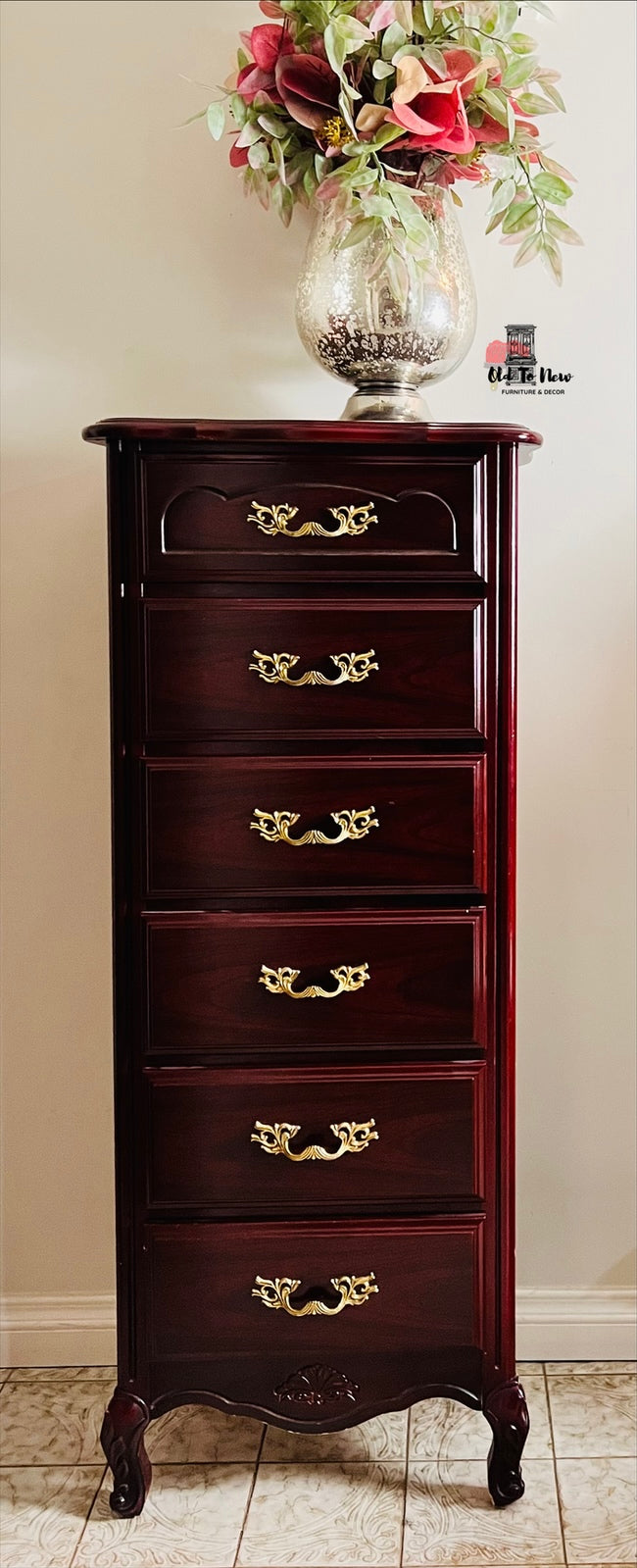 Wooden lingerie dresser with gold handles and a vase of flowers on top against a beige wall. Old to New Furniture & Decor, Canada 