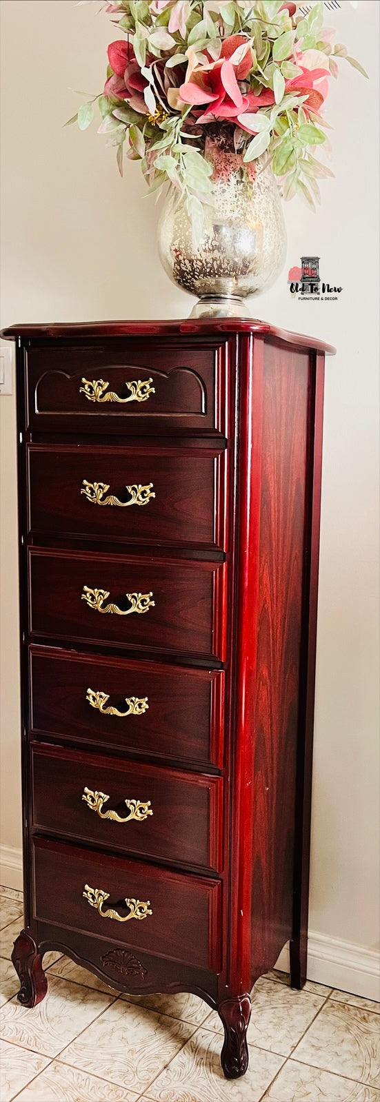 Wooden French Provincial Lingerie dresser with decorative drawers and a vase of flowers on top against a beige wall. Old to New Furniture & Decor, Canada 