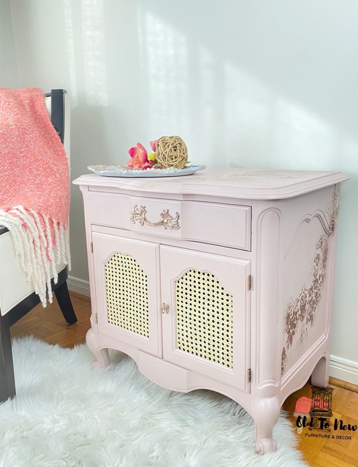 French Provincial Soft blush pink end table with rattan cane inner doors and copper finishes 