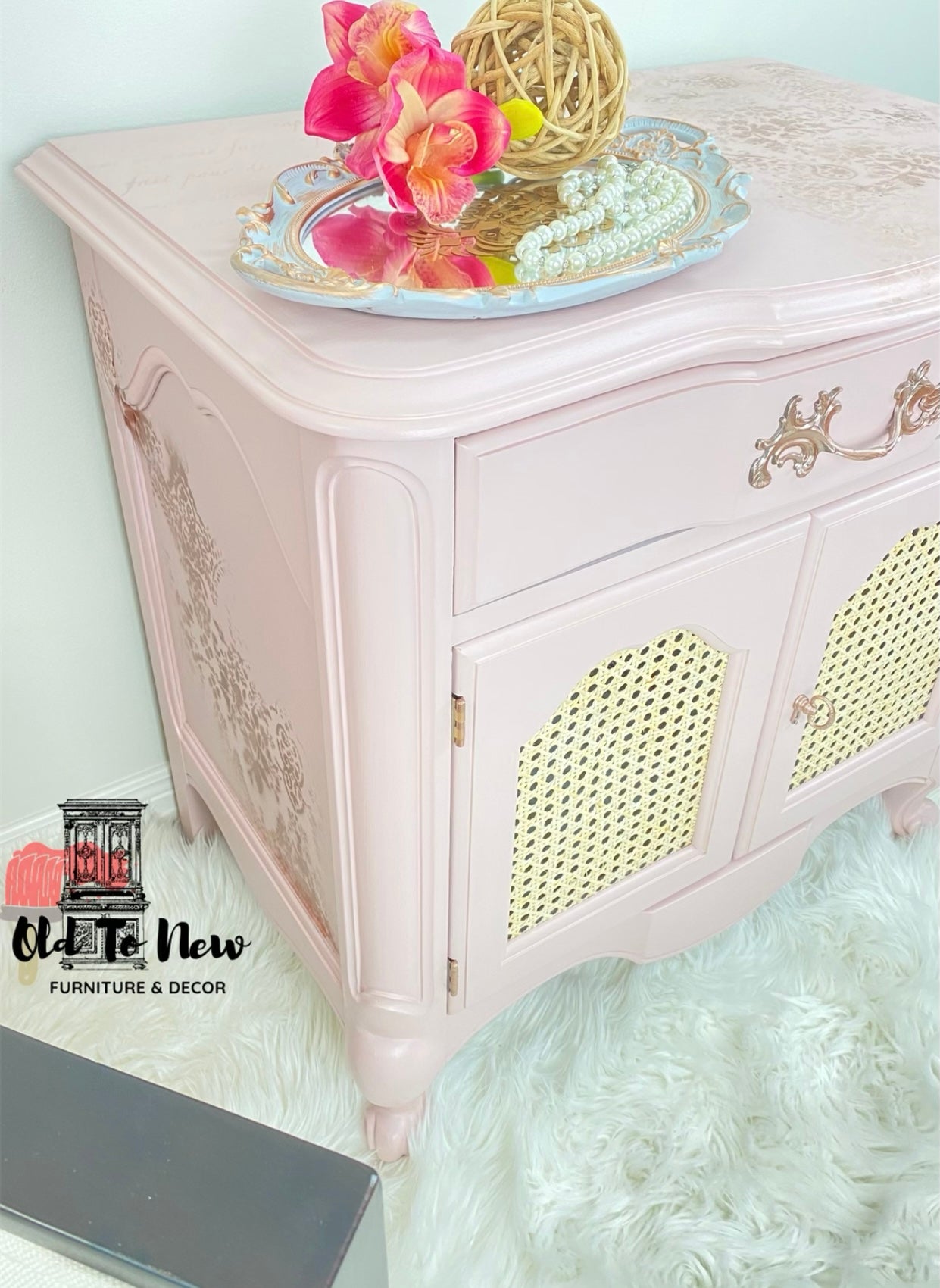 Pink Side Table with  hot Pink orchid and rattan cane door  insert  Painted a soft pink